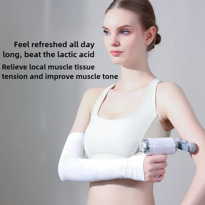 Woman using a mini fascia massage gun on her arm muscles